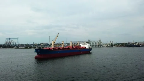 Aerial view of red cargo grain ship floats on the calm sea.  Stock Footage 196393691