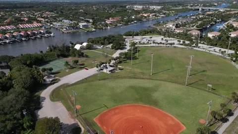 Aerial View of a Red Clay Baseball Diamond Near the Coast Stock-Footage 345837906