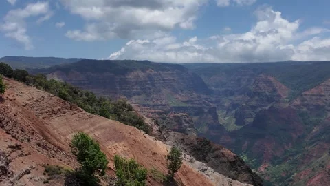 Aerial view of the red cliffs and deep valleys of Waimea Canyon Stock-Footage 347826138