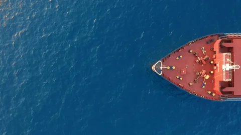 Aerial view. Red deck cargo ship sailing on open sea. Stock Footage 122737535