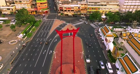 An aerial view of Red Giant Swing and Suthat Thepwararam Temple at sunset sce Stock Footage 227689062