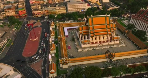 An aerial view of Red Giant Swing and Suthat Thepwararam Temple at sunset sce Stock Footage 227690744