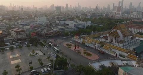 An aerial view of Red Giant Swing and Suthat Thepwararam Temple at sunset sce Stock Footage 292806985