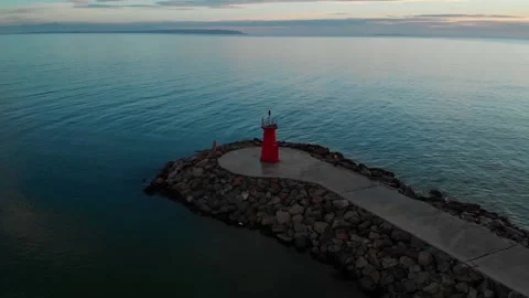 Aerial view of the red lighthouse and a fish boat. Stock Footage 152855008