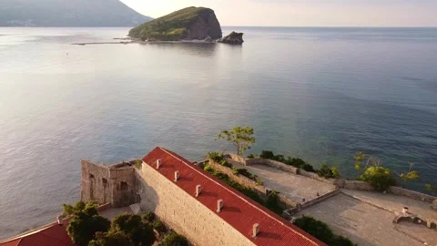 Aerial view of red-roofed stone buildings in coastal Budva Montenegro Video stock 342770395