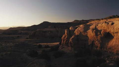 Aerial view of red sandstone cliffs at sunset Stock Footage 127468163