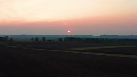Aerial view of the red sunset over the forest Stock Footage 166011678