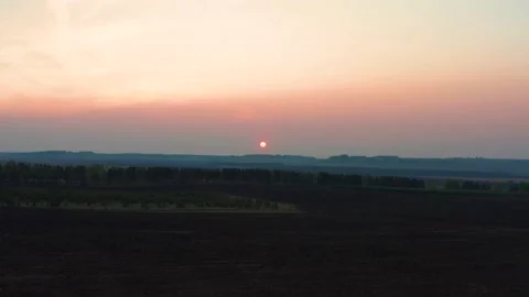 Aerial view of the red sunset over the forest Stock Footage 166014660