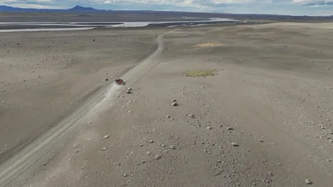 Aerial View Of Red Suv Driving On Remote Gravel Road In Iceland Stock Footage 343079738