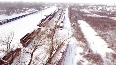 Aerial view of red train DMU leaving railway depot. Stock Footage 149826076
