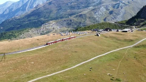 Aerial view of red train in Zermatt, Switzerland. Stock Footage 337648776