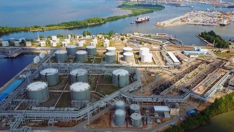 Aerial view of Refinery plant and huge coneiner ship Stock Footage