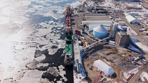 Aerial view of refinery tanks and pipelines winter canada Stock Footage 329452455