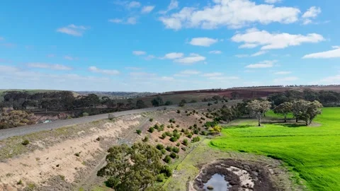 Aerial view of regional train line cut through farmland  in Rowsley Australia 스톡 동영상 344909657