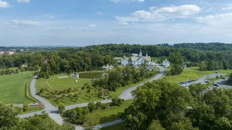 Aerial View Religious Complex With Multiple White Buildings Shining Golden .. Stock Photos