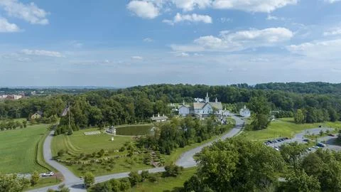Aerial View Religious Complex With Multiple White Buildings Shining Golden .. Stock Photos