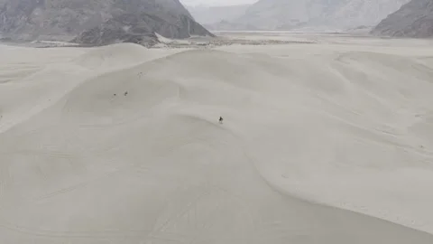 Aerial View of a Remote Desert Landscape in Pakistan, Featuring Sand Dunes and Stock Footage 314454422