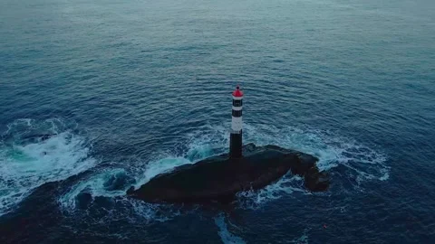 Aerial View of Remote Lighthouse Amidst Crashing Waves in the Atlantic Stock Footage 315743241