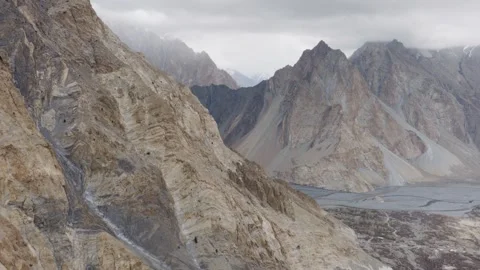 Aerial View of a Remote River Valley in Pakistan, Highlighting Majestic Stock Footage 314457955