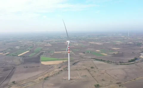 Aerial View of Renewable Wind Energy Infrastructure Installed Across Dry Farming Stock Footage 342680728