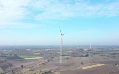 Aerial View of Renewable Wind Energy Infrastructure Installed Across Dry Farming Stock Footage 342681666