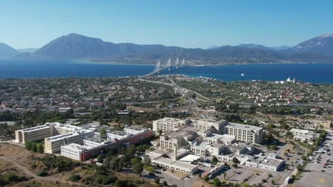 Aerial view of research hub, cityscape and Rio-Antirrio Bridge Stock Footage 338106988