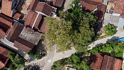 Aerial view of a residential area featuring traditional houses with red til.. Stock Footage 281140417