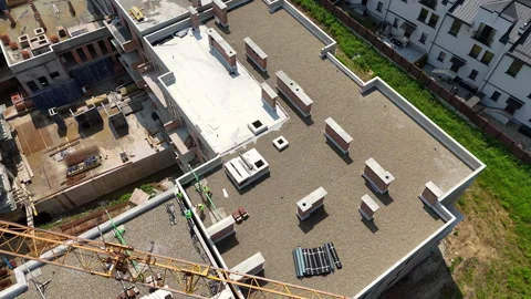 Aerial view of residential complex construction with crane over rooftops Video stock 311076386