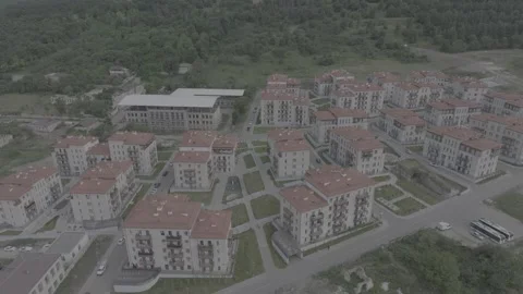 Aerial View of Residential Complex in Green Mountain Landscape Stock Footage 341903584
