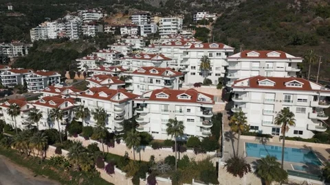 Aerial view of a residential complex of several houses with a swimming pool 動画素材 231016406