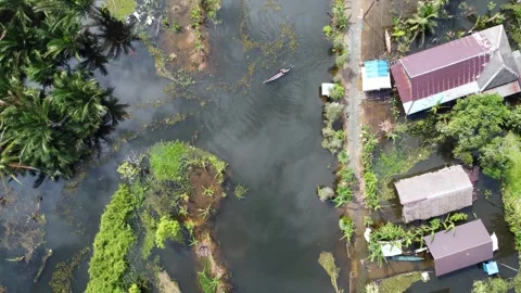 Aerial view of residents' activities using boats in a farmer's settlement i.. Stock Footage 329919923