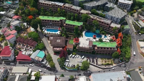 Aerial view of resort complex with pools and surrounding buildings in Thailand Stock-Footage 342331306