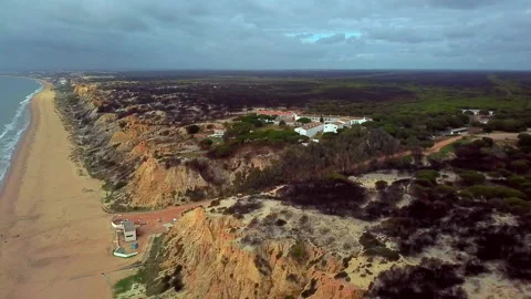 Aerial view of a resort hotel located near a beach with cliffs and you can se Stock Footage