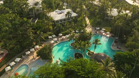Aerial view of a resort pool at sunset in Punta Cana Stock Footage 306268383