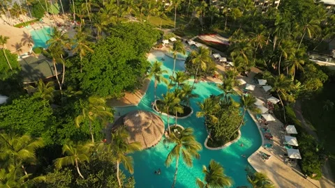 Aerial view of a resort pool at sunset in Punta Cana Stock Footage 306270568