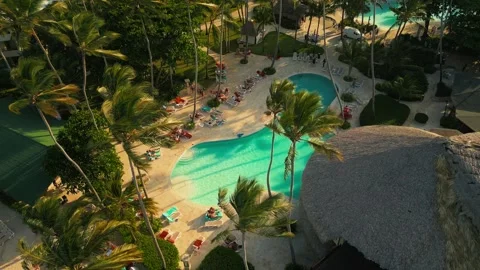 Aerial view of a resort pool at sunset in Punta Cana Stock Footage 306270977