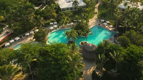 Aerial view of a resort pool at sunset in Punta Cana Stock Footage 306271534