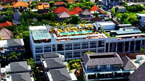 Aerial view of a resort with a rooftop pool in Bali, Indonesia. Stock Footage 340775977