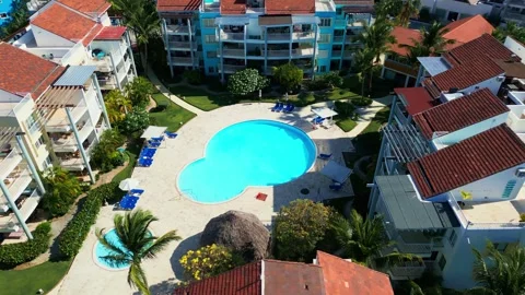 Aerial View of Resort-Style Pool at Luxury Condo in Tropics in Punta Cana Stock Footage 309940641