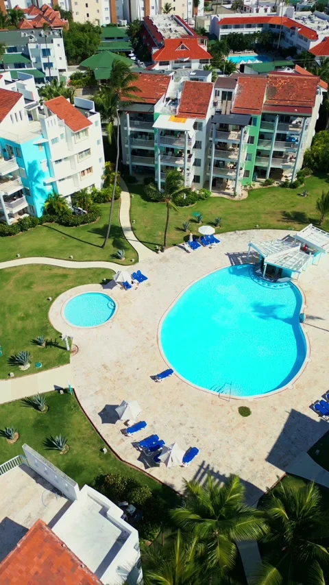 Aerial View of Resort-Style Pool at Luxury Condo in Tropics in Punta Cana Stock Footage 309941723