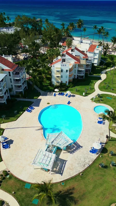 Aerial View of Resort-Style Pool at Luxury Condo in Tropics in Punta Cana Stock Footage 309942253