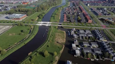 Aerial view reverse flight of modern sustainable neighbourhood netherlands Video stock 154140875