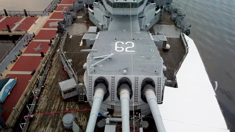 Aerial view of a reverse pass over the Battleship USS New Jersey Stock Footage 136185251