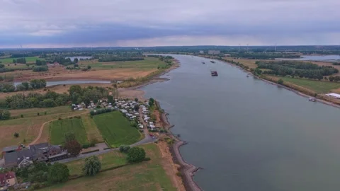 Aerial view of the rhine river with low water levels and cargo ships Vidéo 342809408