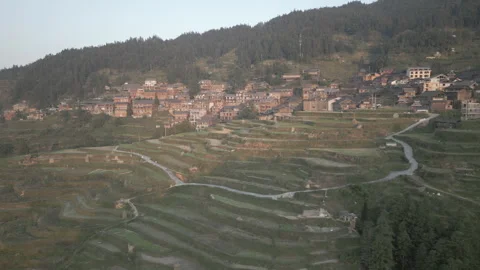 Aerial View of Rice Terraces and Village in Zhaoxing, Guizhou, China at Twilight Stock Footage 315515853