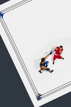 Aerial view on ring with two competitive men, boxers in motion, fighting. Combat Stock Photos