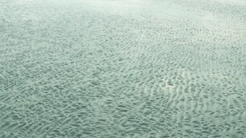 Aerial View of Rippled Sand Patterns on Low Tide Beach Horizon Stock Footage 239171430