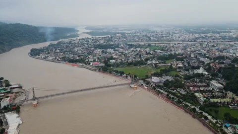 Aerial view of Rishikesh city during monsoon, Drone shot of Janki Setu Stock Footage 161114440