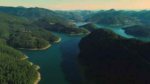 Aerial view rising drone shot of mountain lake and green hills Zaovina Serbia Stock Footage 342242059
