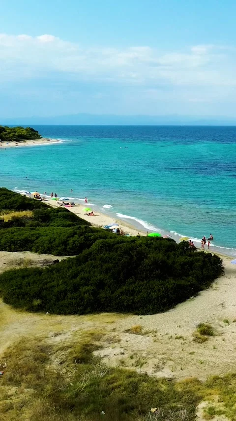 Aerial view rising over sandy beach and turquoise sea, Greece Stock Footage 342238588